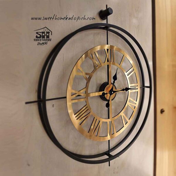 تصویر ساعت دیواری فلزی دو رینگ مشکی-طلایی 1