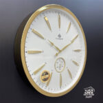 تصویر ساعت دیواری شوبرت طلایی صفحه سفید فلزی